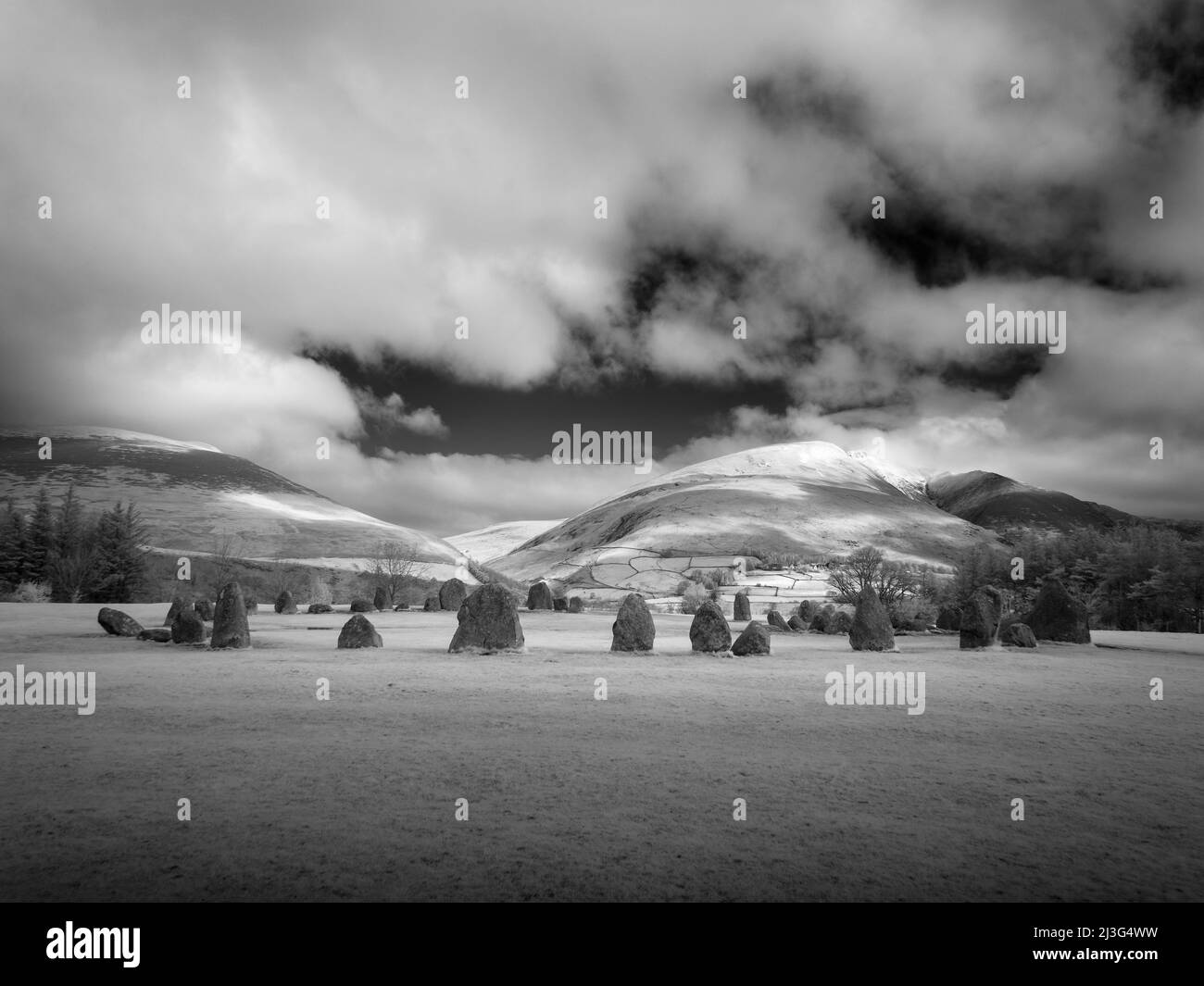 An infrared image of Castlerigg Stone Circle with Blencathra or Saddleback fell beyond in the English Lake District National Park, Cumbria, England. Stock Photo