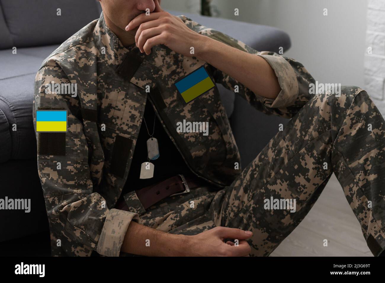 Ukrainian man warrior dressed in a military pixel uniform the yellow ...