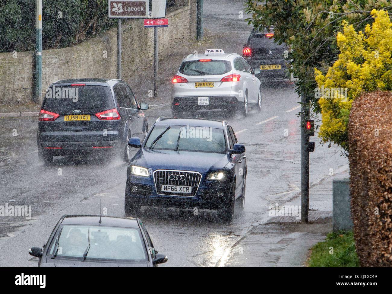 Chippenham, Wiltshire, UK. 8th April, 2022. Drivers are pictured braving heavy rain in Chippenham as heavy rain showers make their way across the UK. Credit: Lynchpics/Alamy Live News Stock Photo
