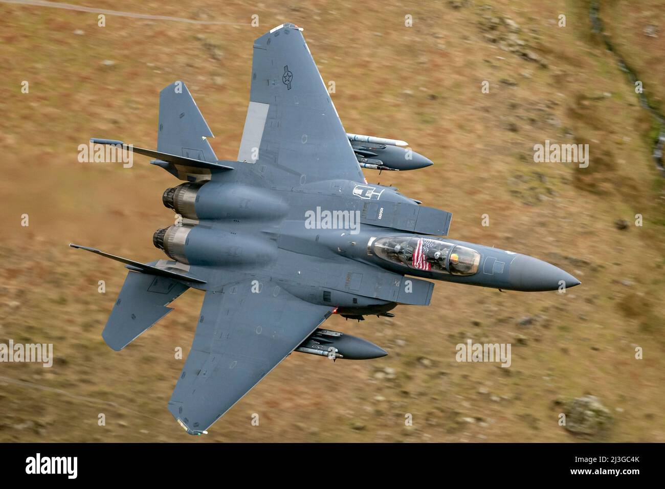 USAF F-15E Strike Eagle from RAF Lakenheath 48th F/W, 494th Fighter Squadron, powering through a low level flying sortie in the Lake District Stock Photo