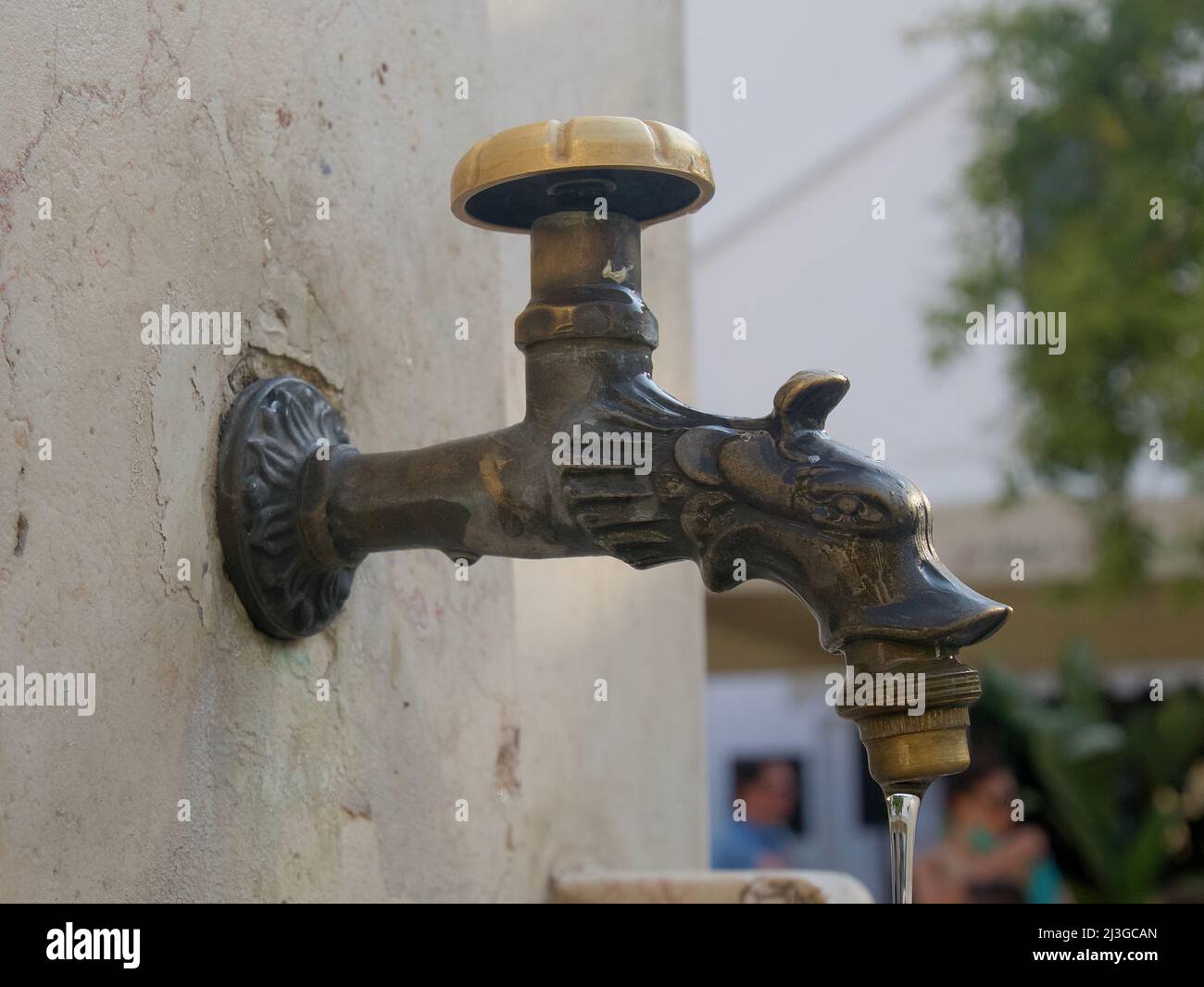 Vintage water tap - public drinking well in Monopoli, Puglia, Italy Stock Photo