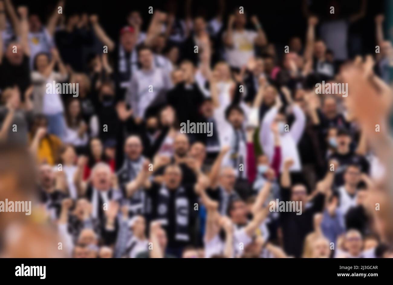 blurred background of supporters at sports event crowd of people in a