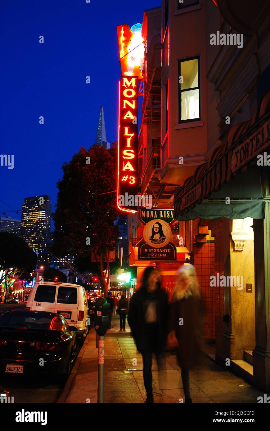 People enjoy walking past the restaurants and Italian cafes of San