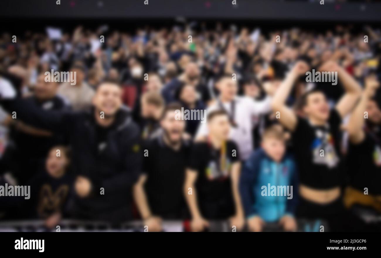 blurred background of supporters at sports event crowd of people in a