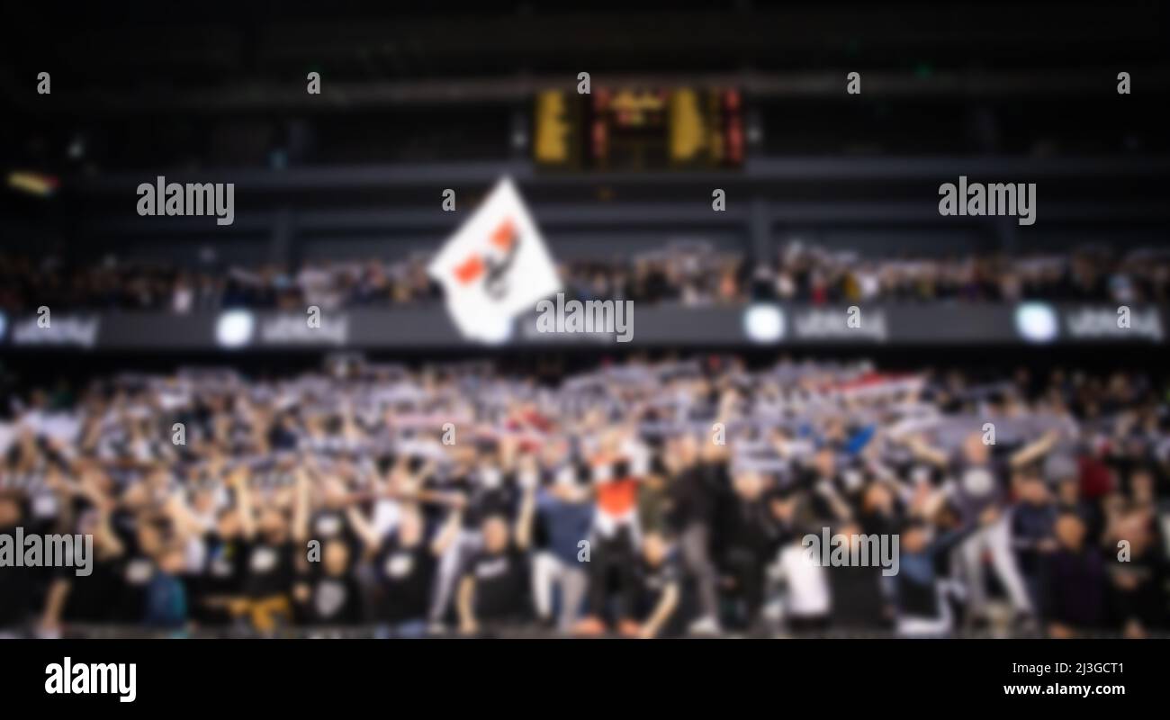 blurred background of supporters at sports event crowd of people in a