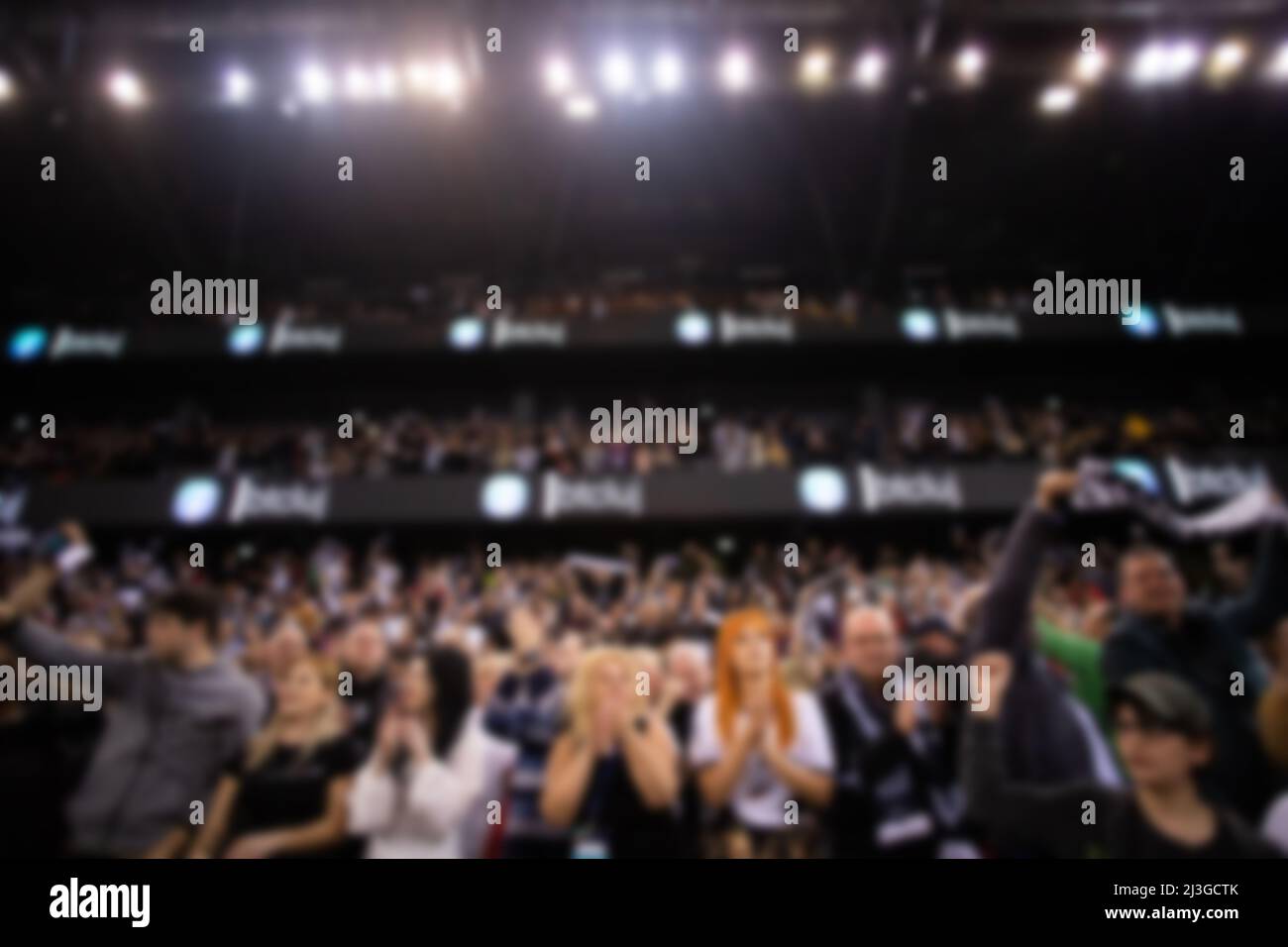 blurred background of supporters at sports event crowd of people in a