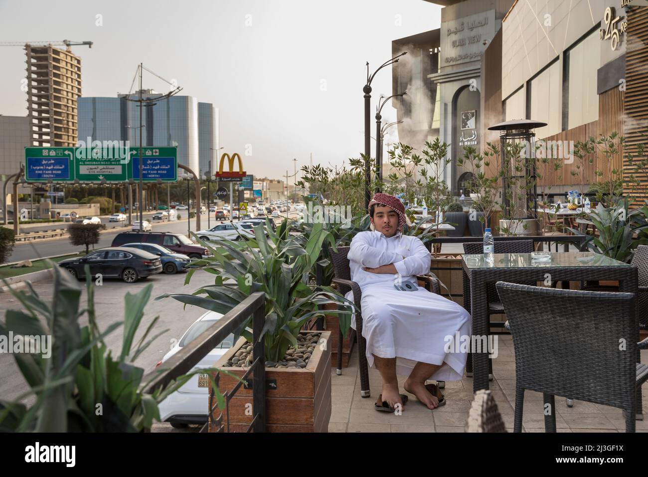 Riyadh, Saudi Arabia, 1st April 2022: saudi man and street picture of Riyadh, Olaya street Stock Photo