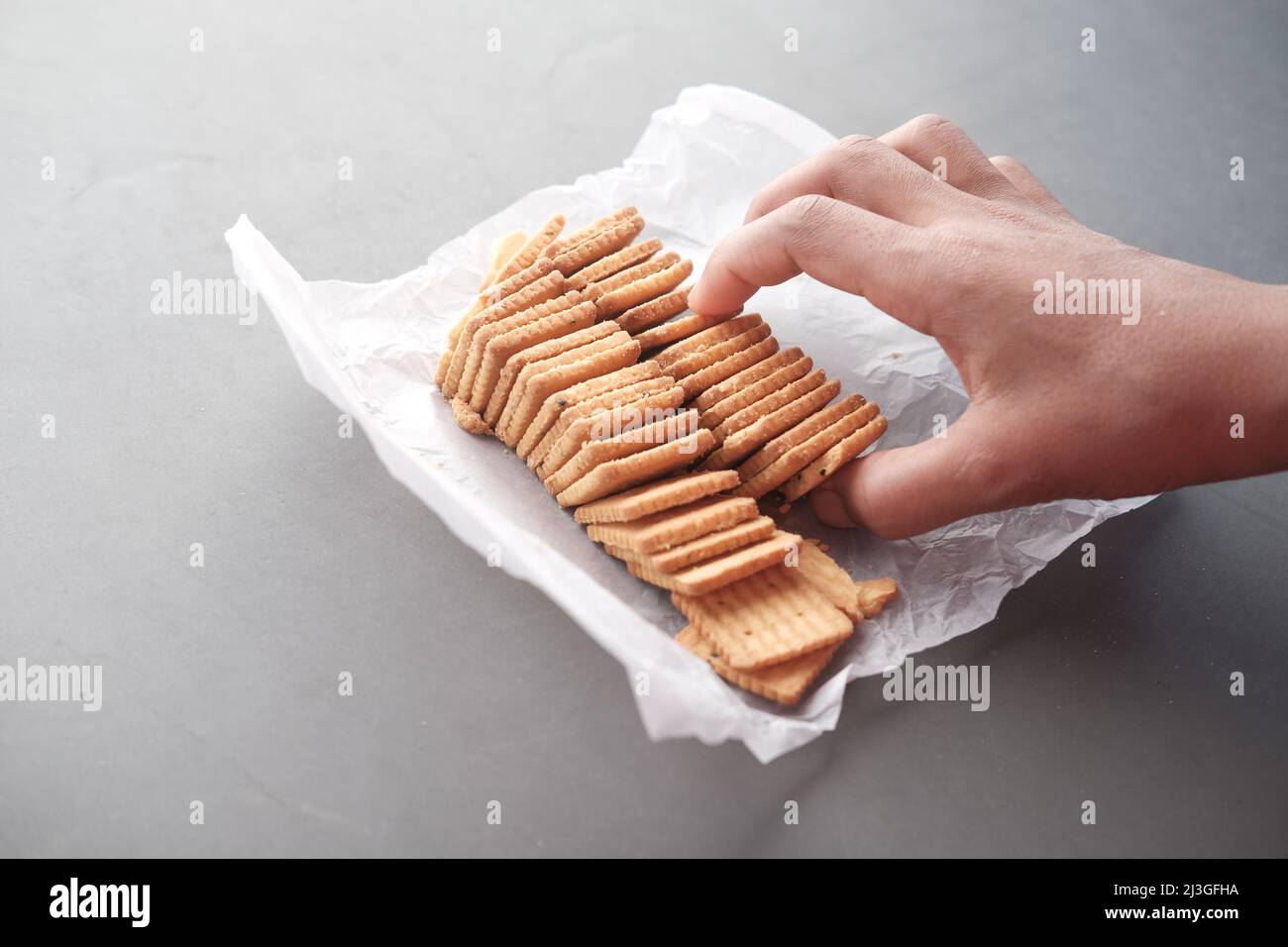 top view of sweet cookies in a plastic packet on wooden table Stock ...