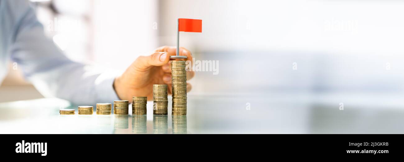 Money Inflation And Coins. Investor Saving Wealth Stock Photo