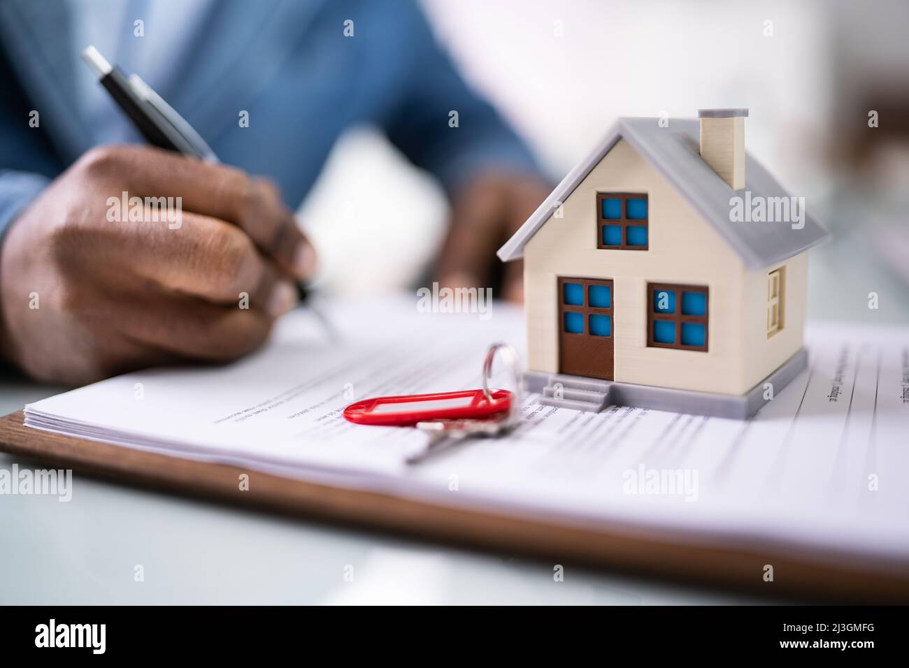 Signing House Rental Contract Document And Property Lending Stock Photo