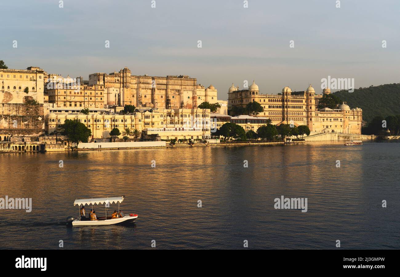 Maharajah's palace as viewed from Lake Pichola at sunset under blue sky in Udaipur, Rajasthan, India. Stock Photo