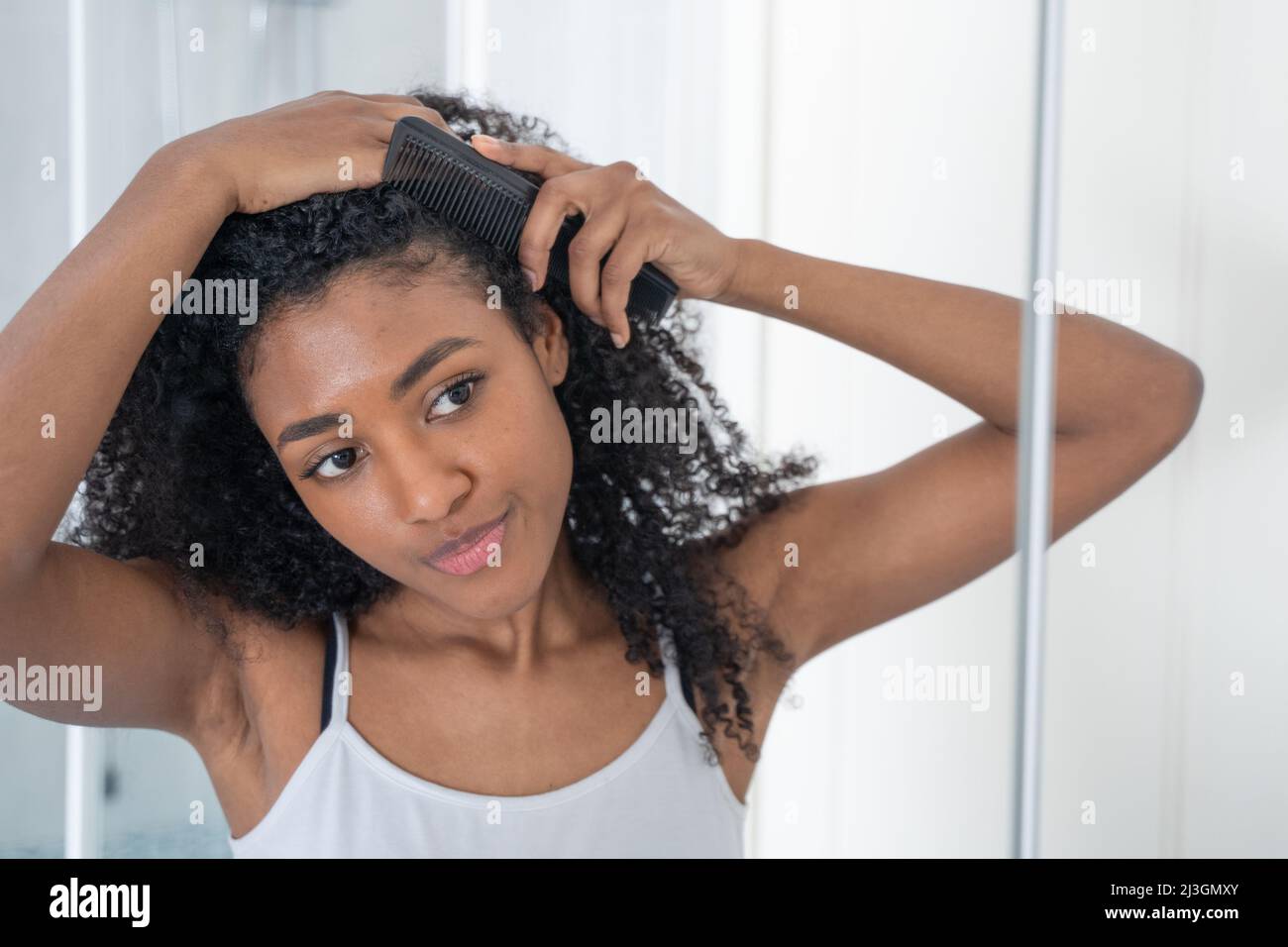 Black curly hair hi-res stock photography and images - Alamy