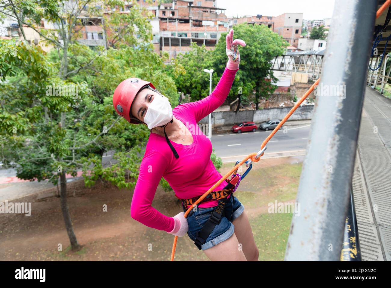 Salvador, Bahia, Brazil - October 24, 2021: Female rappelist going down ...