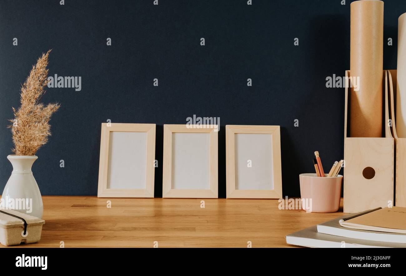 Set of three frames on office desk Stock Photo Alamy