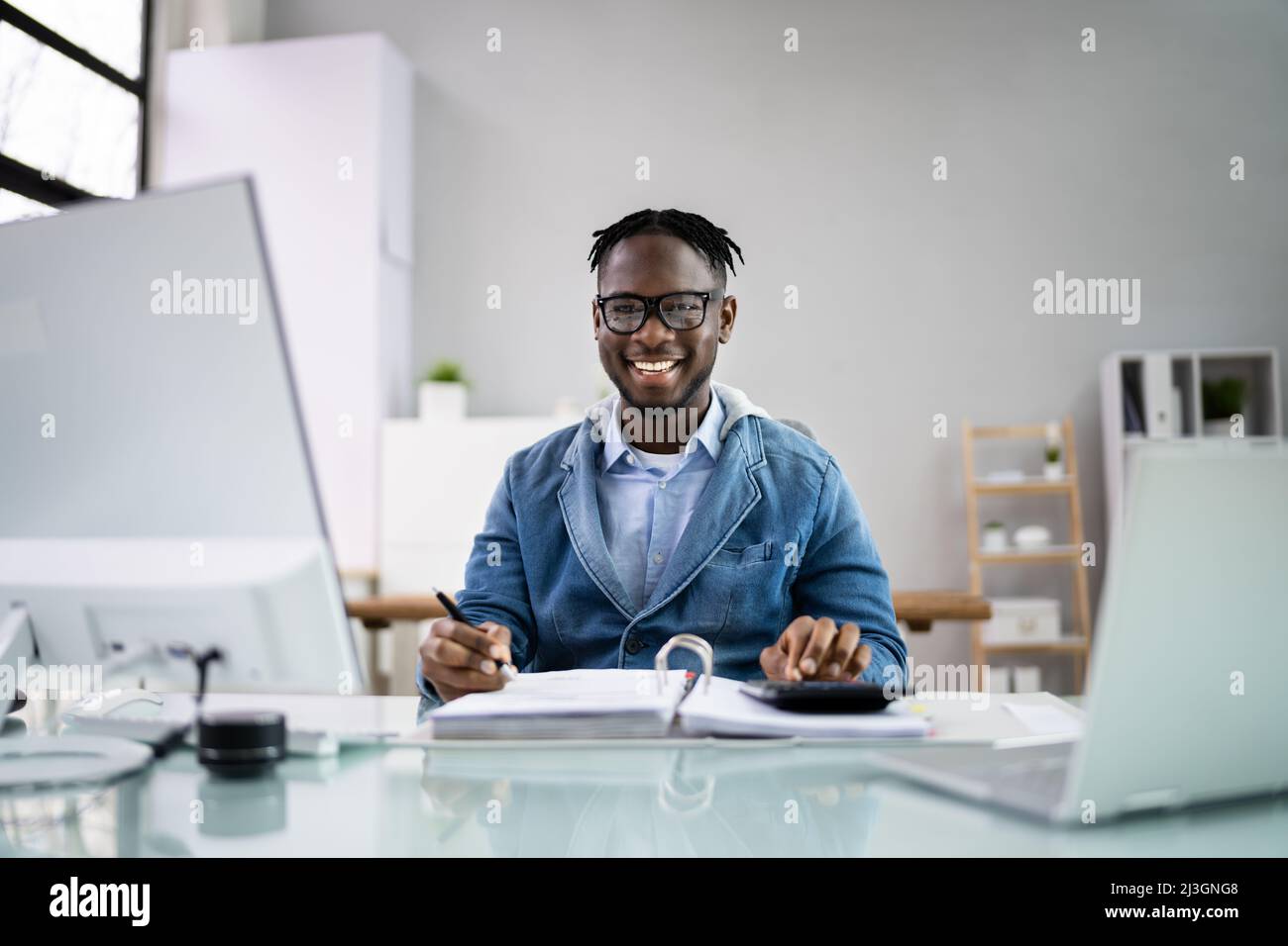 Accountant Women At Desk Using Calculator For Accounting Stock Photo ...