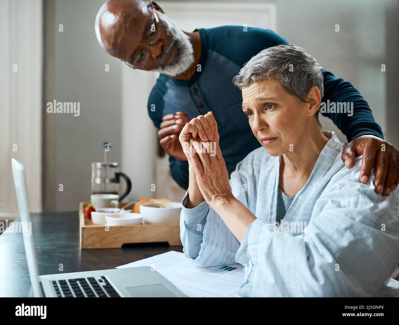 I know its stressful but Im here for you. Shot of a senior married couple stressed out doing their budget at home. Stock Photo