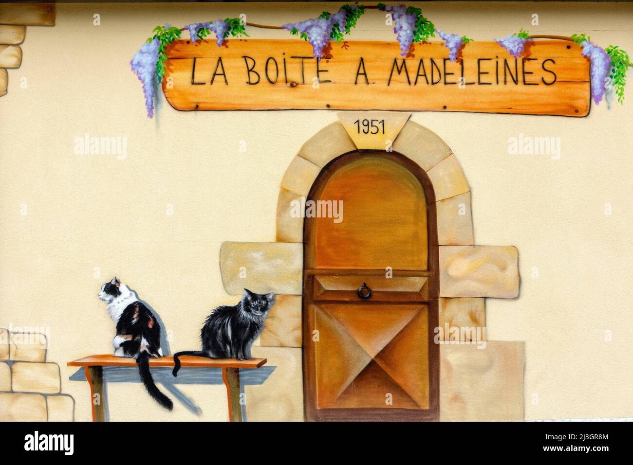 France, Meuse, Commercy, mural painting on the wall of the shop and workshop making madeleines of Commercy La Boite à Madeleines by the Zins brothers, madeleiniers since 1951 Stock Photo