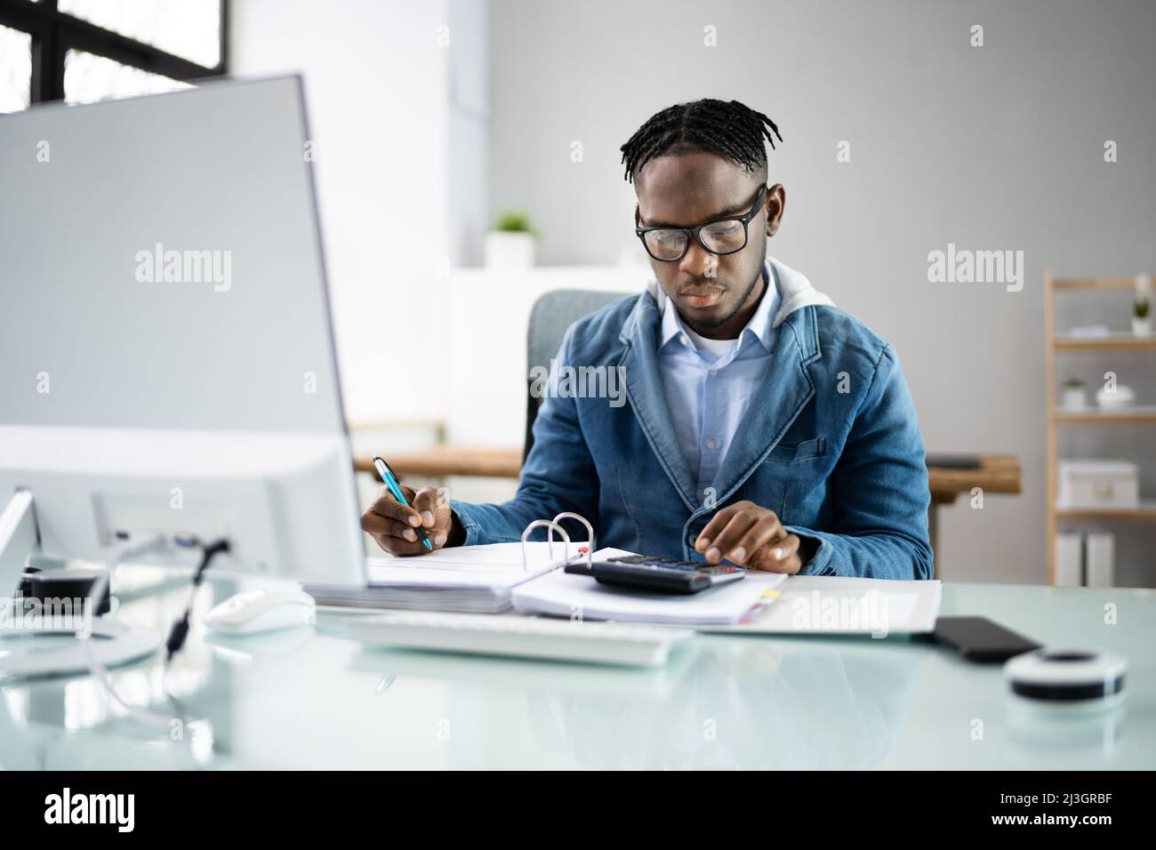 Business Accountant Accountant And Bookkeeper. Invoice And Calculator Stock Photo