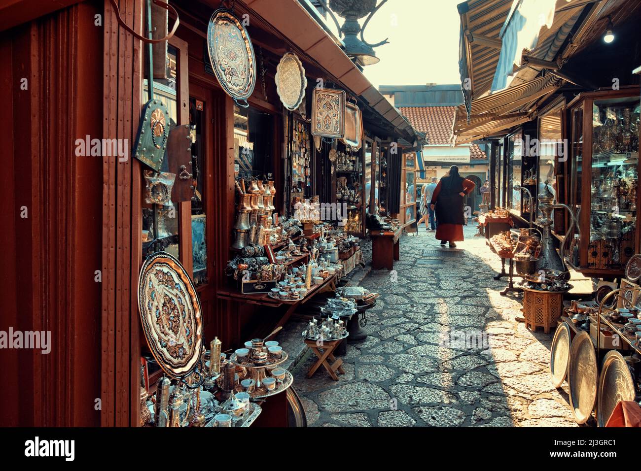 SARAJEVO, BOSNIA AND HERZEGOVINA - JULY 14, 2018: muslim woman walking in Old Sarajevo street bazaar Stock Photo