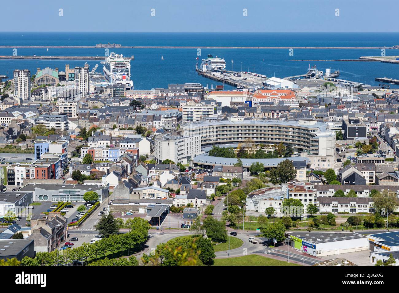 France, Manche, Cotentin, Cherbourg-Octeville, general view of the Cotentien Public Health Center, the Cité de la Mer museum with cruise ship MS Azura at quay, the ferry terminal and the residential areas Stock Photo