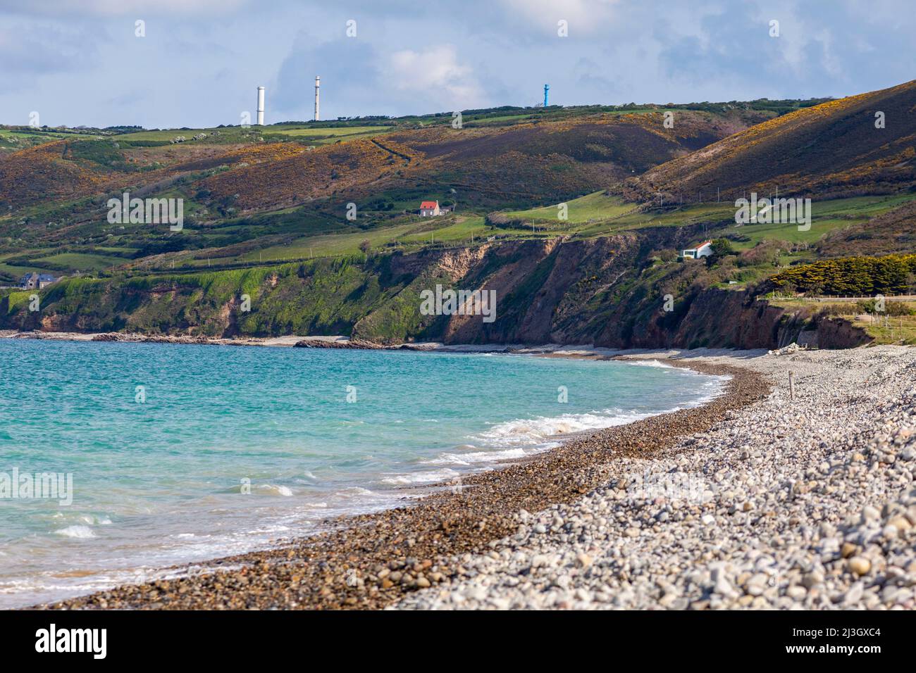 France, Manche, Cotentin, Cape Hague, Vauville, turquoise blue sea and Vauville cove beach, listed as a Natura 2000 site, crossed by the GR223 coastal path and La Hague Nuclear Fuel Reprocessing Plant in the background Stock Photo