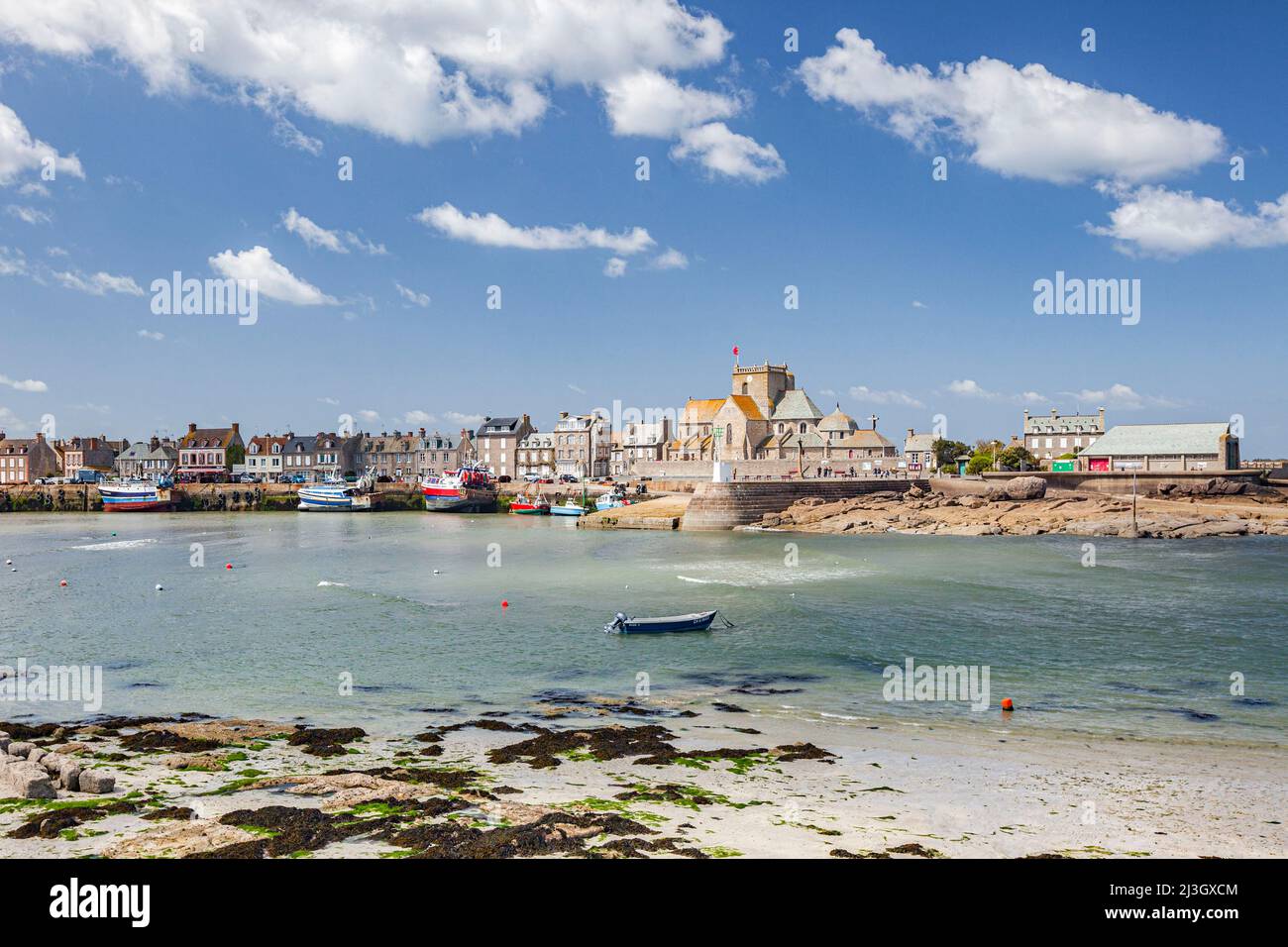 France, Manche, Cotentin, Barfleur, labeled The Most Beautiful Villages of France, entrance to the fishing and beaching harbour and Saint-Nicolas church Stock Photo