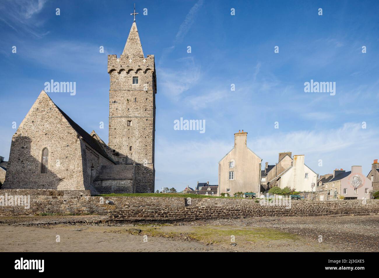 France, Manche, Cotentin, Portbail, Notre-Dame church with its fortified bell tower, listed as a historical monument, and seaside village Stock Photo