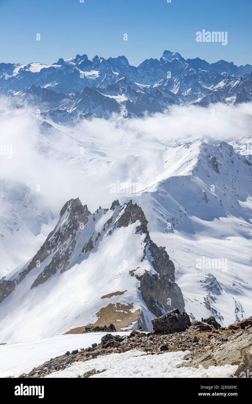 France, Hautes-Alpes, Névache, Ski touring raid, from the summit of Mont Thabor (3178m), seen on the Pointe des Angelières, in the background seen on the Ecrins massif, the Barre des Ecrins (4102 m) Stock Photo