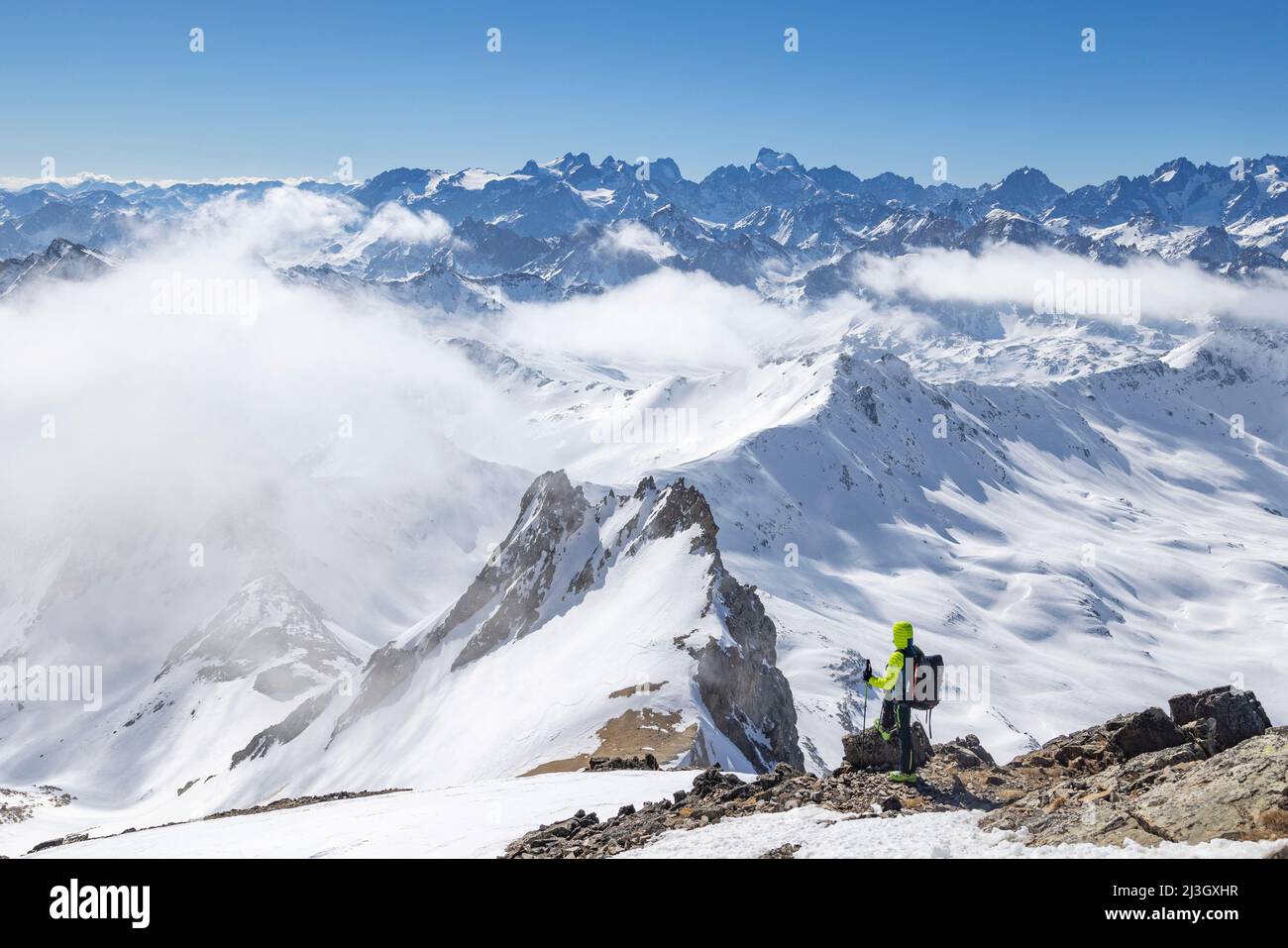 France, Hautes-Alpes, Névache, Ski touring raid, from the summit of Mont Thabor (3178m), seen on the Pointe des Angelières, in the background seen on the Ecrins massif, the Barre des Ecrins (4102 m) Stock Photo