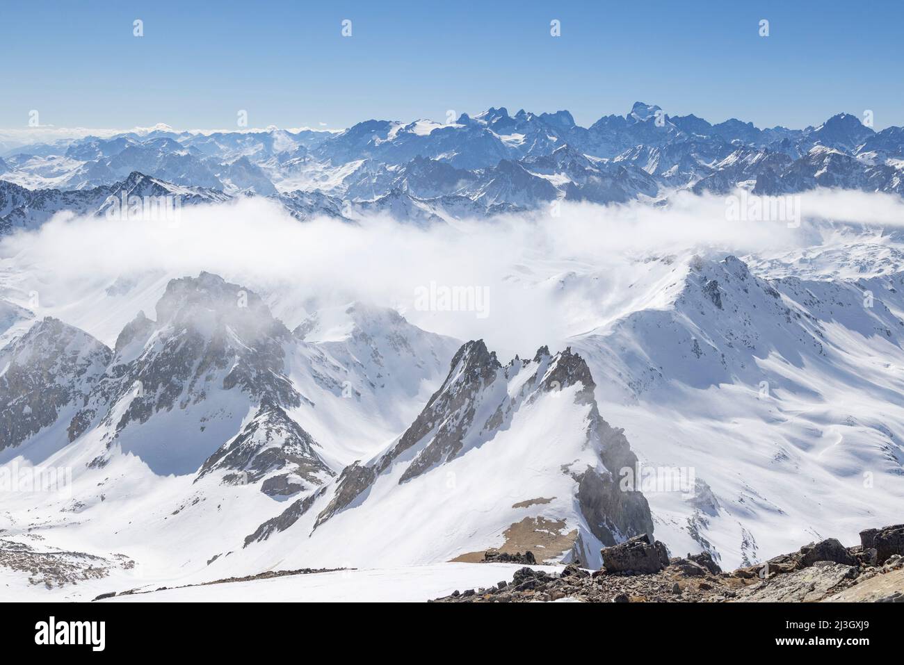 France, Hautes-Alpes, Névache, Ski touring raid, from the summit of Mont Thabor (3178m), seen on the Pointe des Angelières, in the background seen on the Ecrins massif, the Barre des Ecrins (4102 m) Stock Photo