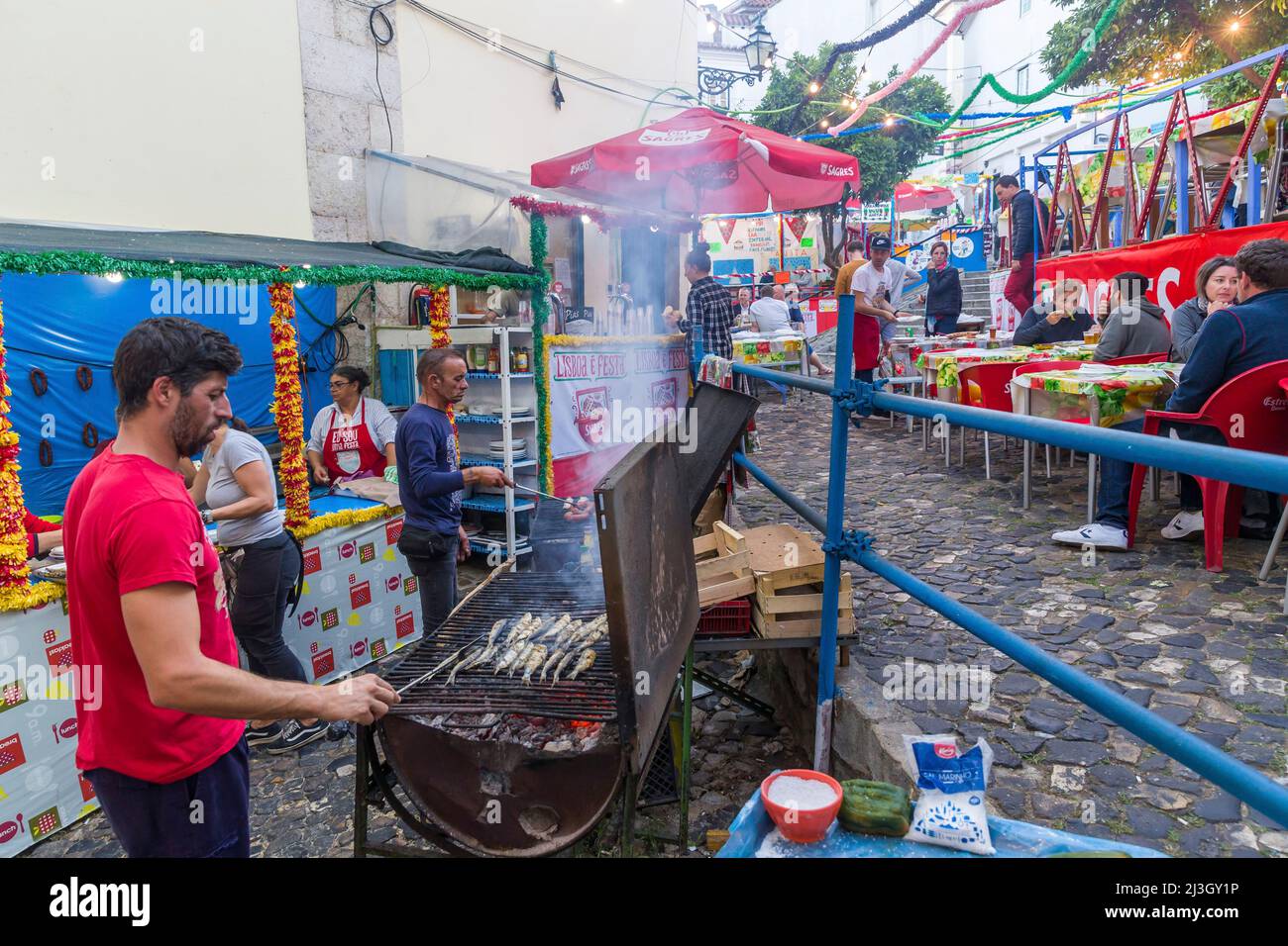 Portugal, Lisbon, Alfama district, grilled sardines in the street