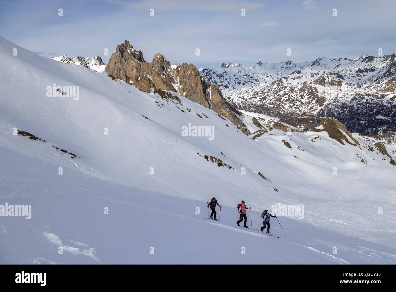 France, Hautes-Alpes, Névache, Ski touring raid, climbing to the Pointe du Demi (2817 m) Stock Photo