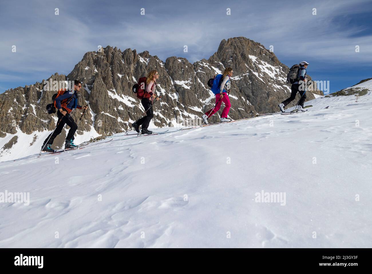 France, Hautes-Alpes, Névache, Ski touring raid, climbing to the Pointe du Demi (2817 m), the Raisin crests in the background Stock Photo