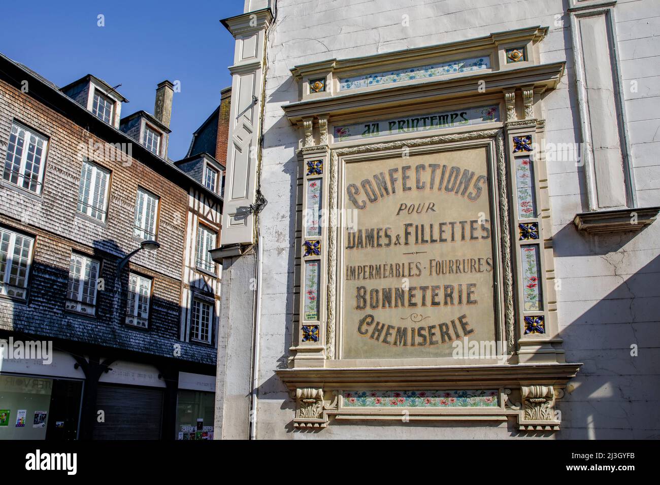 France, Normandy, Eure, Risle Valley, Pont-Audemer, labeled the Most Beautiful Detours of France, nicknamed the Little Venice of Normandy, advertising sign of the Au Printemps department store, dating from the end of the 19th century Stock Photo