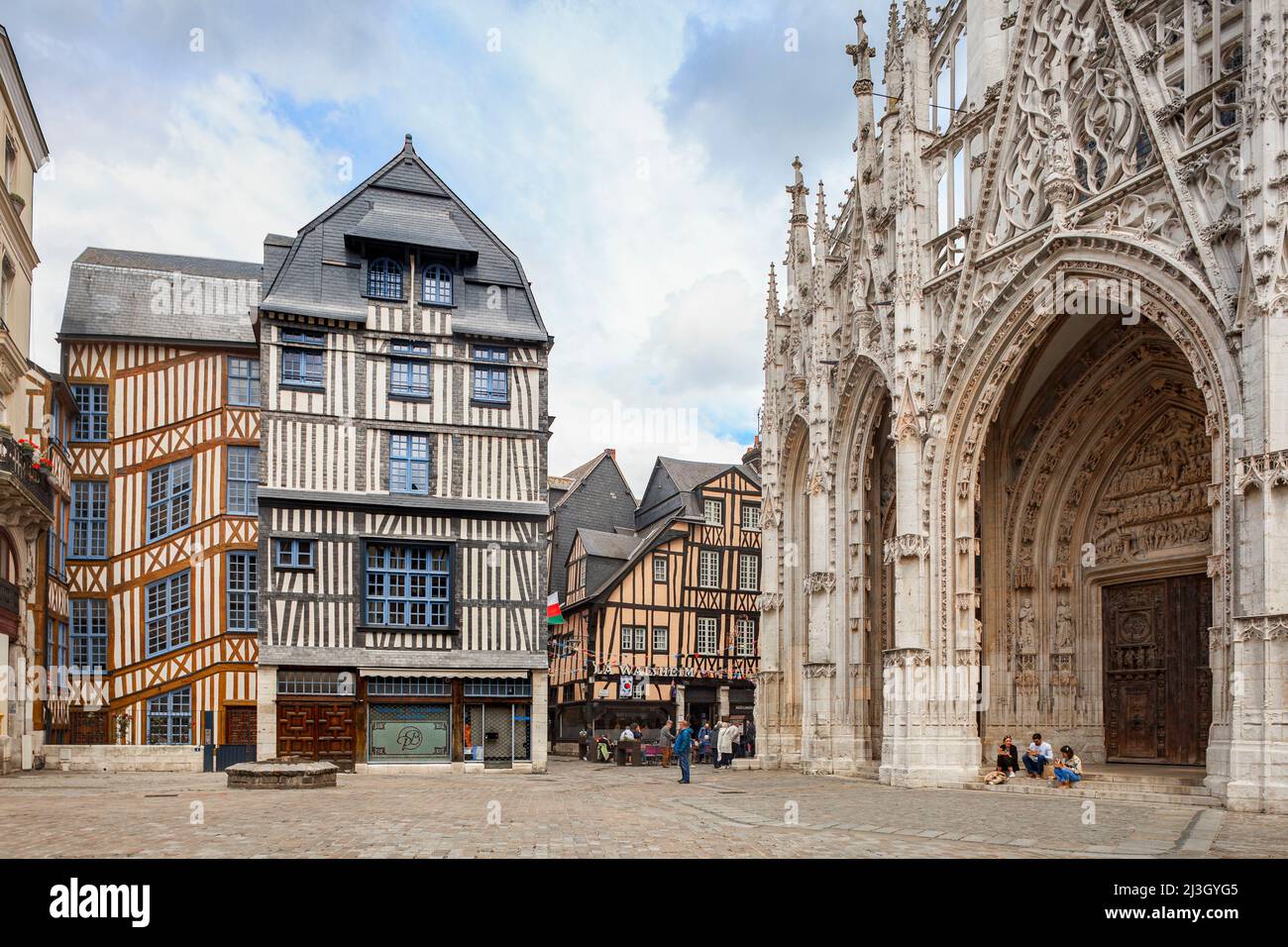 France, Seine-Maritime (76), Rouen, place Barthélémy, forecourt of the Saint-Maclou church and famous half-timbered house named La Maison qui Penche Stock Photo