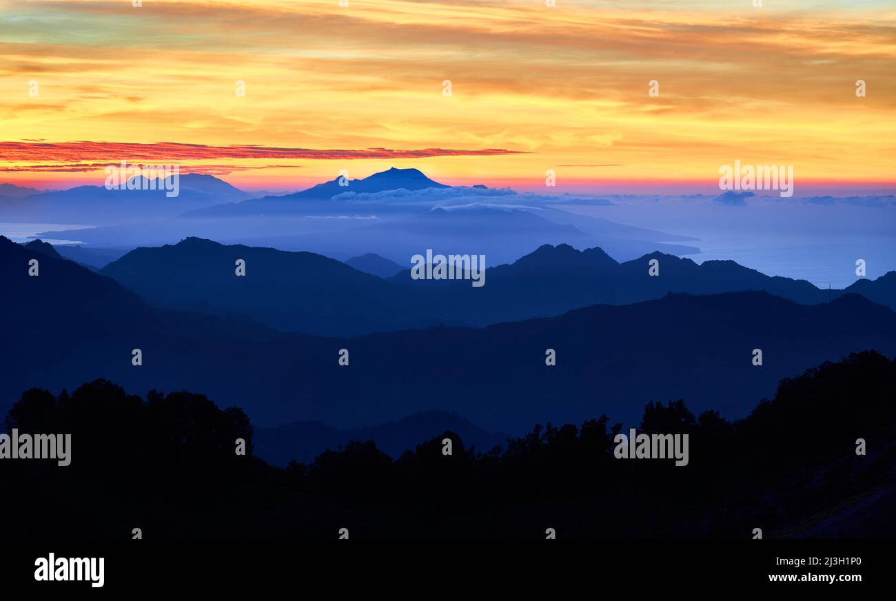 Sunrise over the mountains at Kelimutu volcano. Ende Regency, East Nusa Tenggara, Flores, Indonesia, Asia. Travel photo. Stock Photo