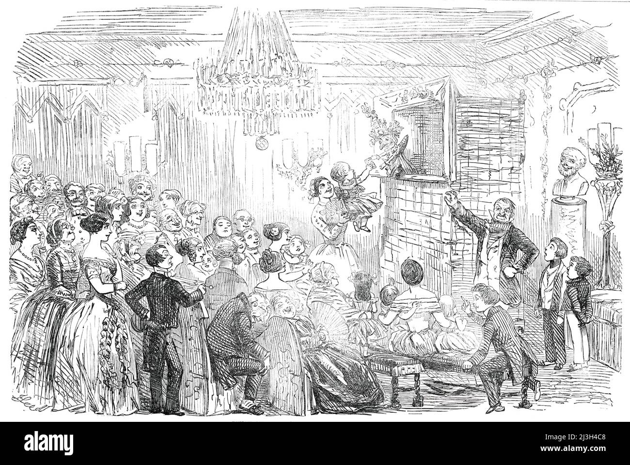 Punch and Judy at Christmas - drawn by Leech, 1850. Illustration to &quot;Christmas Interiors&quot;, an article by the Old Batchelor. '&quot;This 'ere's a nice party,&quot; [Mr. Punch] remarked to me confidentially, &quot;and refreshments werry liberal; but, bless you, I've performed afore 'arf the Dooks and Markisses in England, I 'ave&quot;. His &quot;pardner&quot; (as the gentleman is called, who converses with Mr. Punch when that individual is not occupied in murdering his friends and disposing of the bodies of his victims, or suffering from illness or remorse) was a grave man, who appeare Stock Photo