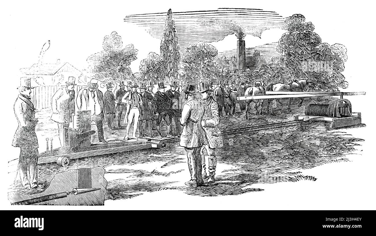 Fowler's New Subsoil Draining Plough, 1850. 'An experimental trial of Fowler's Patent Draining Plough and Machinery took place...in a field at the back of Mr. John Smith's iron foundry, at Uxbridge [now part of west London], where considerable improvements have been effected, under the immediate direction of the inventor. The trial..was attended by a large and most respectable body of agriculturists..who watched the operations of the machine with great interest, and were unanimously of opinion, that, when the result of a few more experiments had enabled the inventor to apportion the strength o Stock Photo