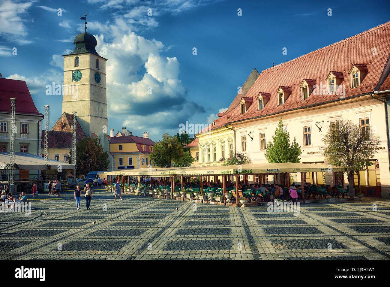SIBIU, ROMANIA - July 30, 2018: Sibiu's Council Tower from Piata Mare square against dramatic sky Stock Photo