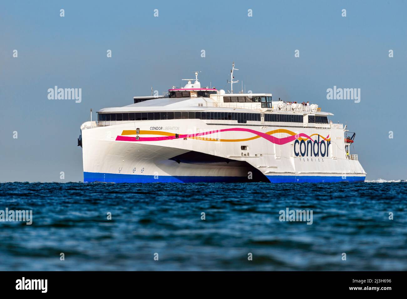 The trimaran Condor Liberation operates a high-speed ferry link between the  UK mainland and the Channel Islands, Jersey and Guernsey - July 2018 Stock  Photo - Alamy