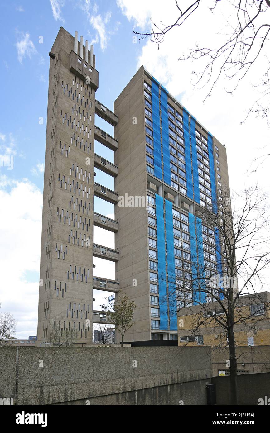 Balfron Tower, London. Famous brutalist tower block by architect Erno Goldfinger. Undergoing refurbishment to luxury flats. Shows temporary netting. Stock Photo