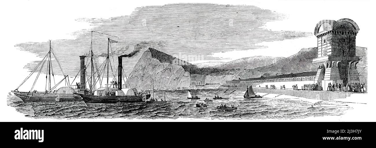 Submarine Electric Telegraph between Dover and Calais - Temporary Station at Dover - Steamers preparing to Start, 1850. Ships laying a telegraph cable between England and France. 'The only conjectured difficulty on the route was at a point in mid-channel, called the Ridge, between which and another inequality called the Varne, both well known and dreaded by navigators, there is a deep submarine valley, surrounded by shifting sands, the one being seventeen miles and the other twelve miles in length. Here ships encounter danger, lose their anchors, and drift; and trolling nets of fishermen are f Stock Photo