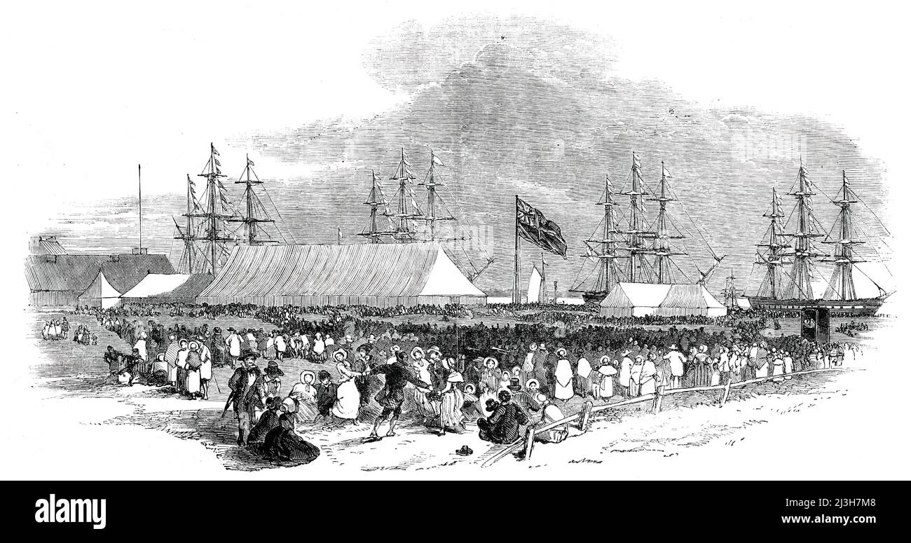 The Canterbury Colonists - scene at Gravesend [in Kent], on Monday, 1850. Settlers bound for New Zealand. A dinner was given '...in the fields adjoining Wate's Hotel...the hotel itself not being able to accommodate so large a party...a regular fair appearing to have sprung up on the spur of the moment...this first squadron for the new colony consists of four vessels, the Sir George Seymour, the Cressy, the Charlotte Jane, and the Randolph, which will convey about 600 passengers out to their new homes'. The settlement was to be peopled '...by those who are of one faith - members of the English Stock Photo