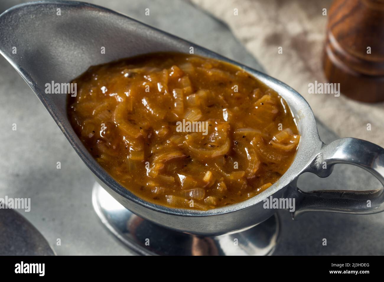 Homemade Brown Onion Gravy in a Boat Stock Photo Alamy