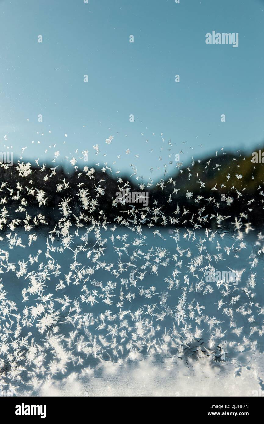 Frozen ice crystals on a window pane in the Rhodope Mountains in Bulgaria Stock Photo