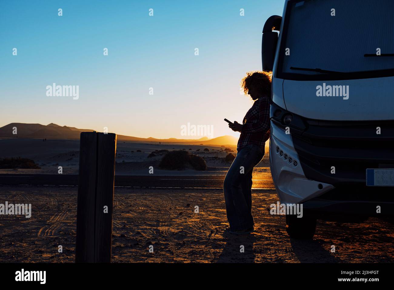 Woman, camper, leaning, sideways, sunset, detail, Stock Photo