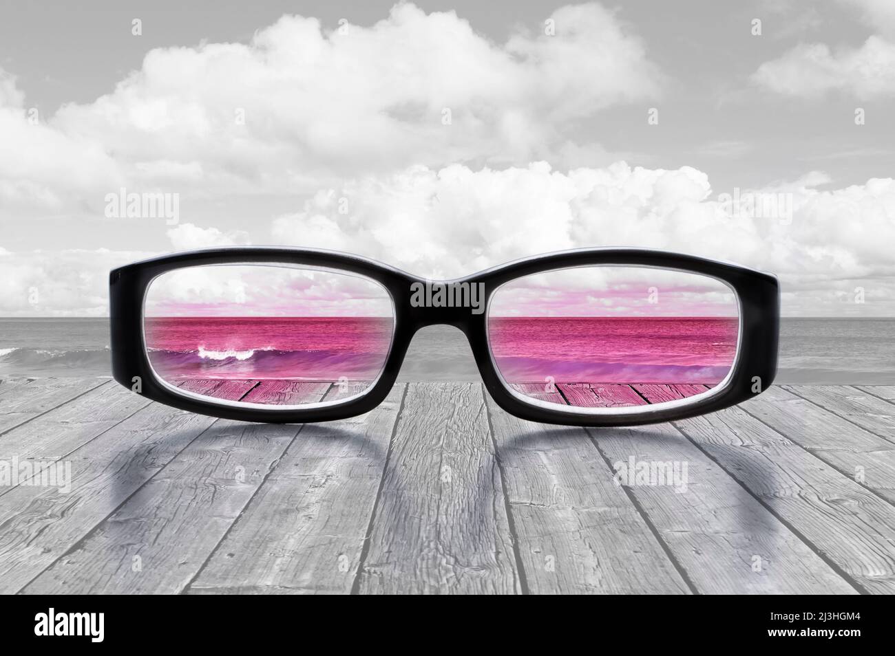 Seeing the world through rose colored glasses Stock Photo
