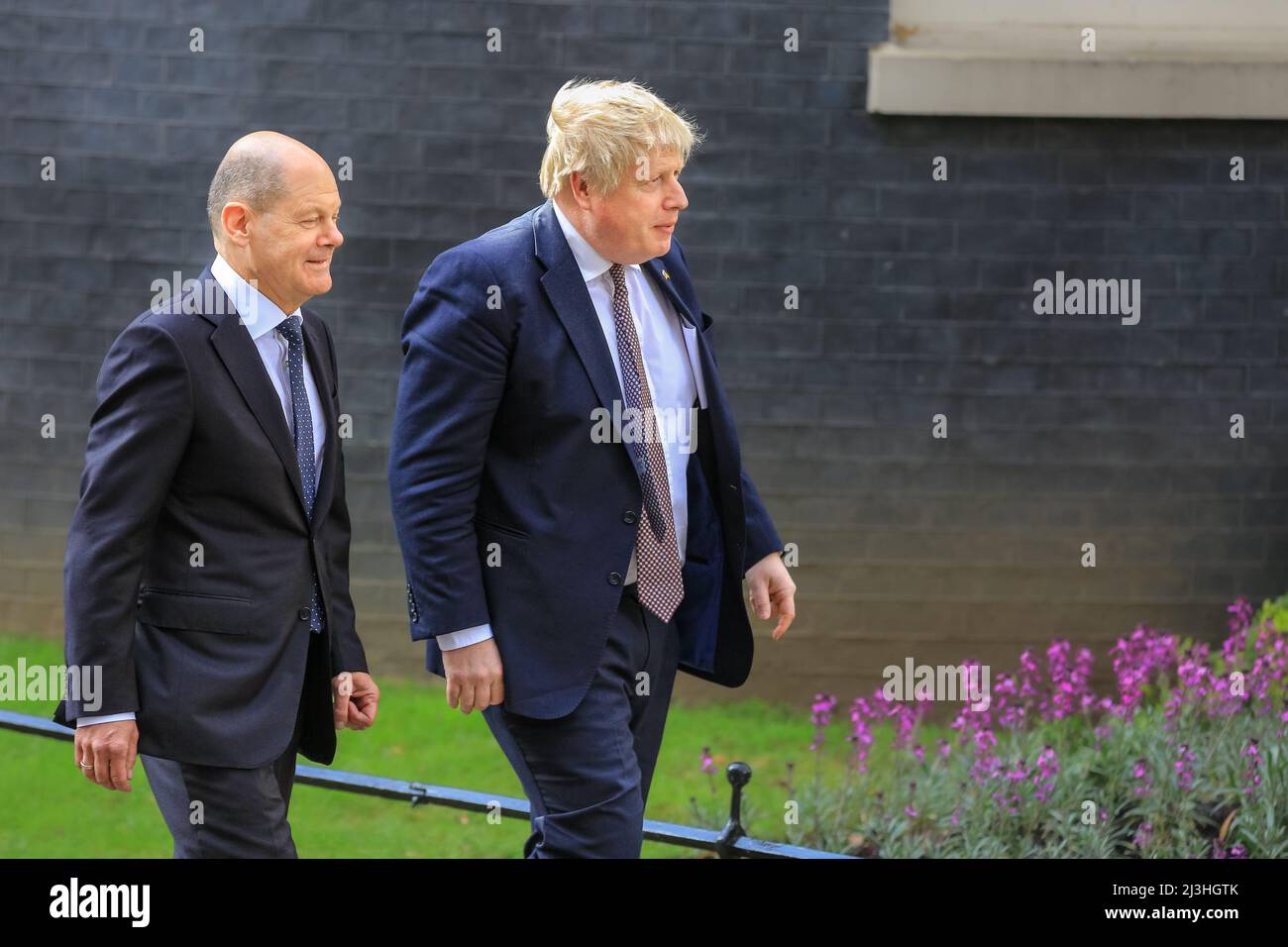 Westminster, London, UK, 08th April 2022. Olaf Scholz and Boris Johnson walk to their press conference at the Cabinet Office. Boris Johnson MP, British Prime Minister welcomes German Chancellor Olaf Scholz today at Downing Street for meetings  to discuss the situation in Ukraine as well as international and bilateral topics. Stock Photo