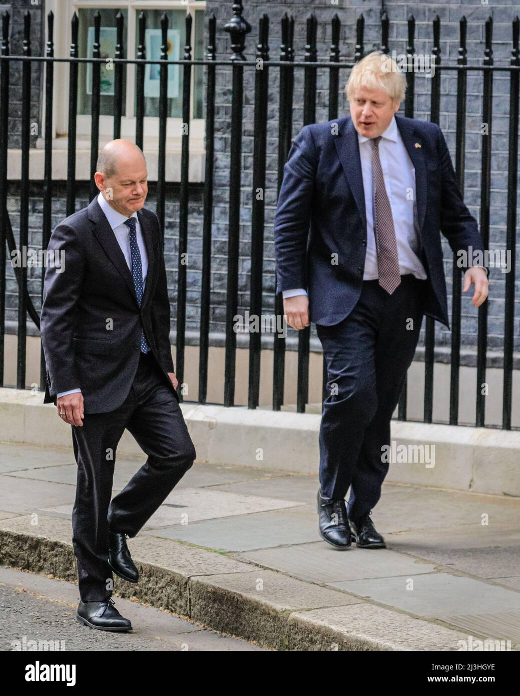 Westminster, London, UK, 08th April 2022. Olaf Scholz and Boris Johnson walk to their press conference at the Cabinet Office. Boris Johnson MP, British Prime Minister welcomes German Chancellor Olaf Scholz today at Downing Street for meetings  to discuss the situation in Ukraine as well as international and bilateral topics. Stock Photo