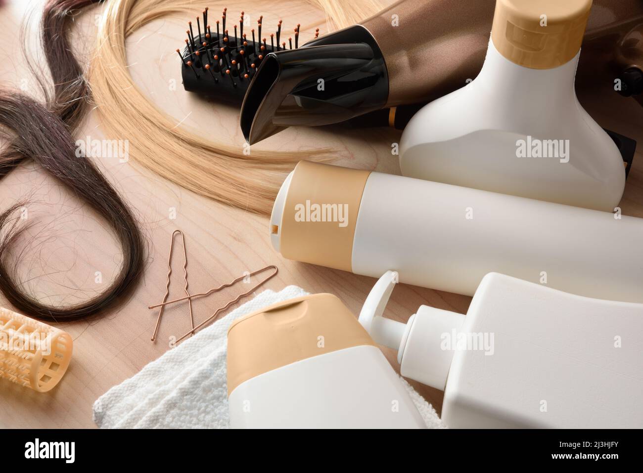 Detail of professional hairdresser and stylist products for hair care on wooden table. Elevated view. Horizontal composition. Stock Photo